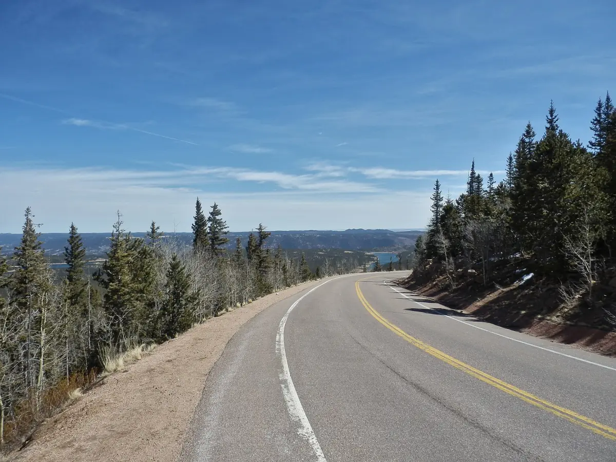 The Pikes Peak Highway climbing through pine forest